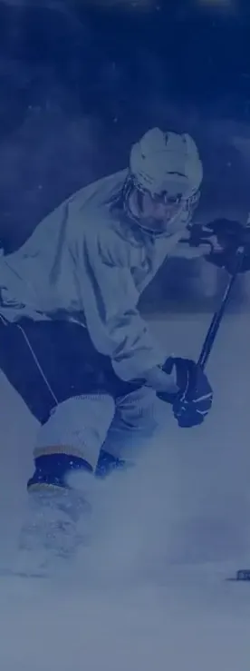 Ice hockey player skating with the puck